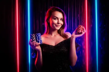 একজন পুরুষ তার ল্যাপটপে জয়ের মুহূর্ত উদযাপন করছেন, চারপাশে ভাসছে গেমিং আইকন—যা CROWNBF গেমসের উত্তেজনাকে প্রকাশ করে।